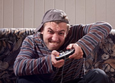 Man with joystick playing video games clipart