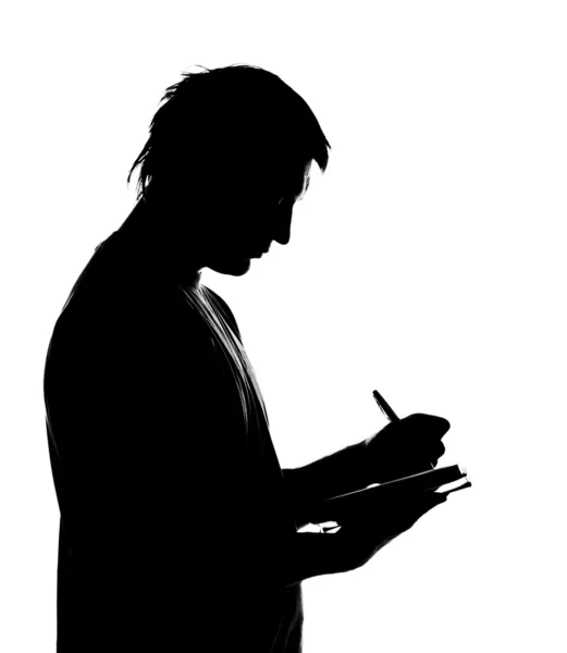 Silhouette az ember üzleti napló írása — Stock Fotó