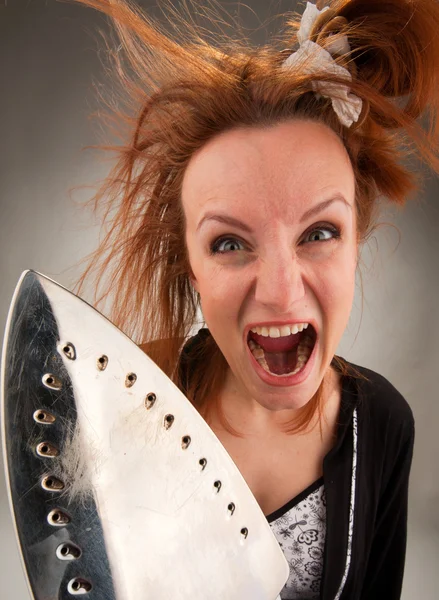 Screaming housewife with steam iron — Stock Photo, Image
