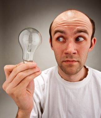 Man holding electrical bulb clipart