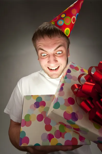 Birthday man opening gift box Stock Image