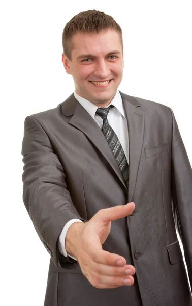 Smiling businessman is going to handshake — Stock Photo, Image