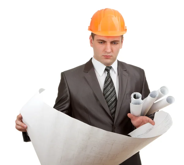 Engineer in hardhat with plans — Stock Photo, Image