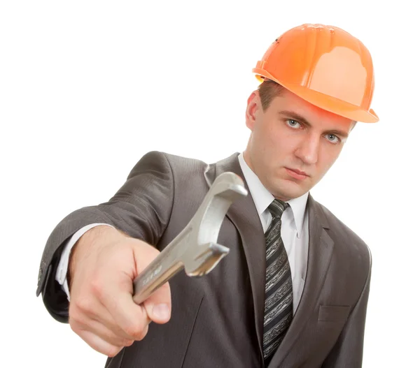 Serious engineer in hardhat with spanner — Stock Photo, Image