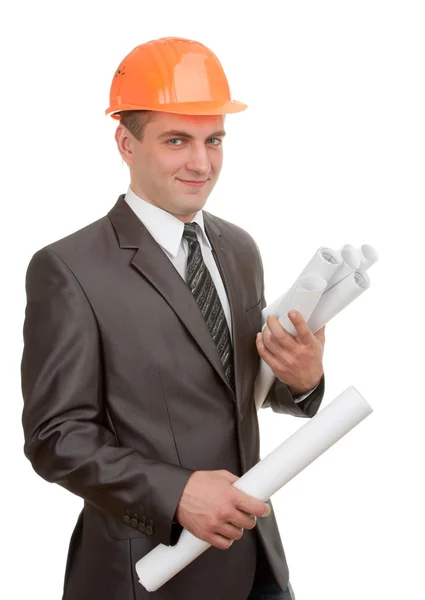 Engineer in hardhat with plans Stock Picture