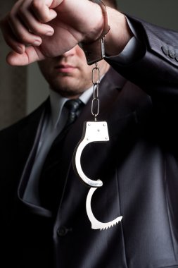 Businessman with unlocked handcuffs clipart