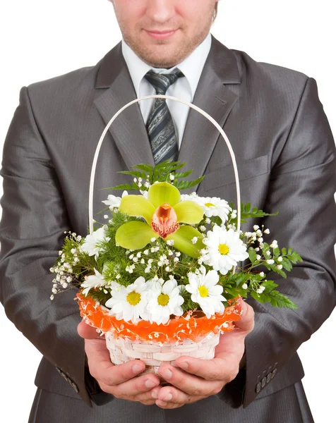 Šťastný podnikatel s košíkem květin — Stock fotografie