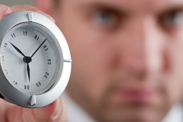 Businessman showing clock to you — Stock Photo, Image