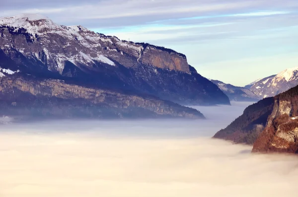 stock image View over a valley of clouds filling