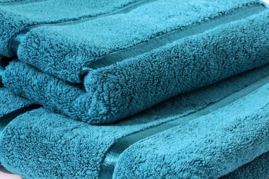 Two turquoise towels close up clipart