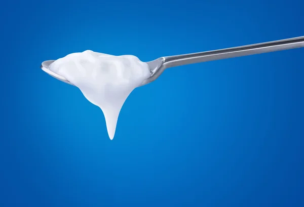 Ложка з йогуртом — стокове фото