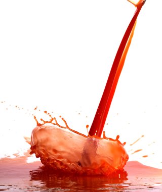 Tomato juice splash in glass white background clipart