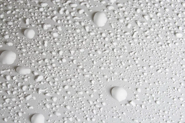 stock image Round water drops on gray background close-up