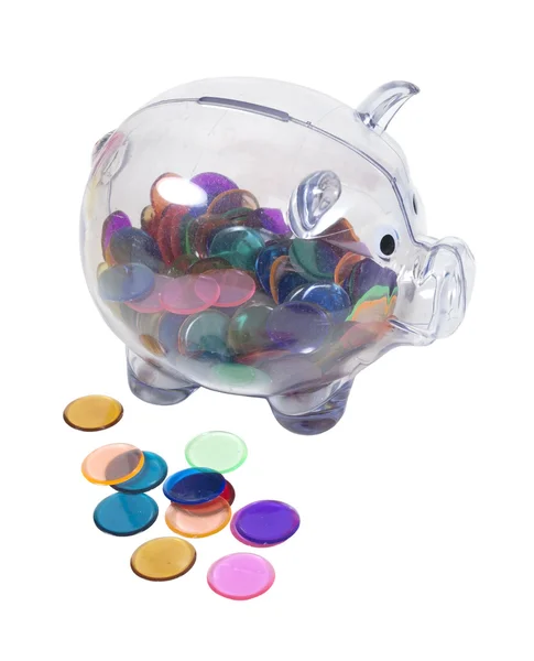 Piggy bank vol met kleurrijke chips — Stockfoto