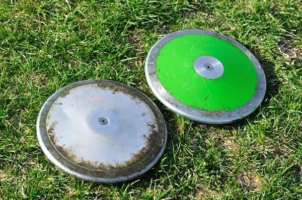 Срібний і зелений диск — стокове фото