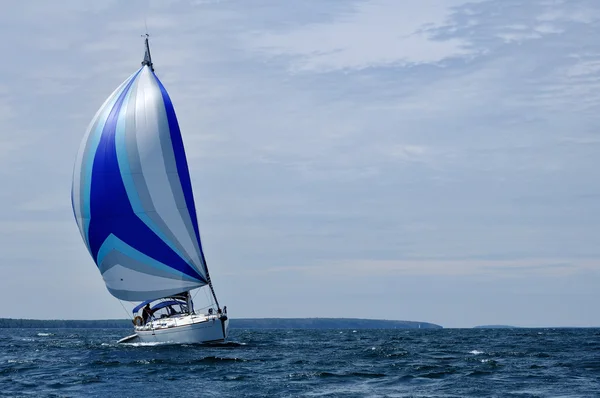 Sailboat with Blue Spinnaker Sail — Stock Photo, Image
