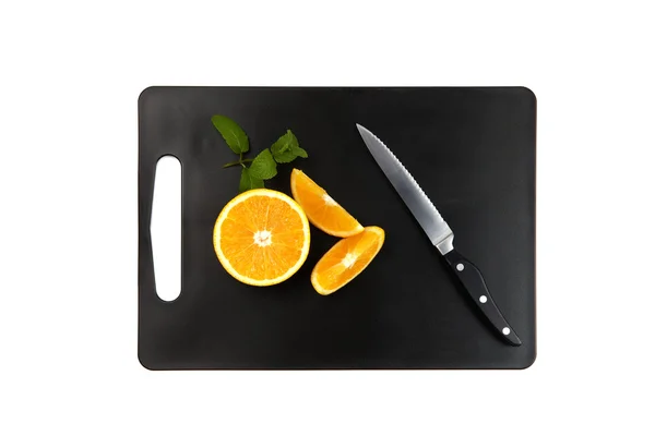 Snijplank met sinaasappels en mint — Stockfoto