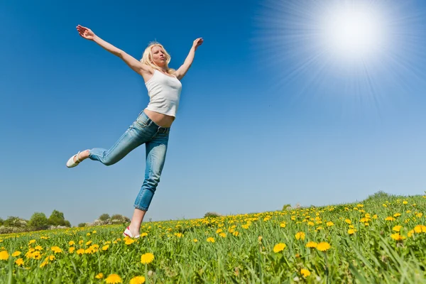 Happy young woman on meadow — Stock Photo, Image