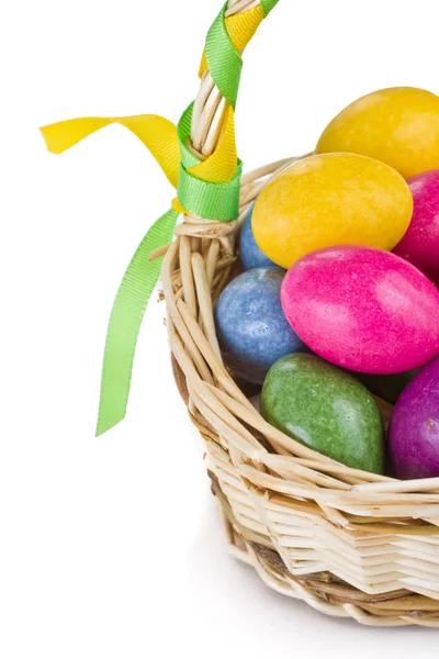 Colorful easter eggs in basket — Stock Photo, Image