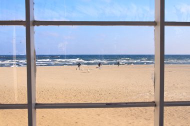 Beach view through window clipart