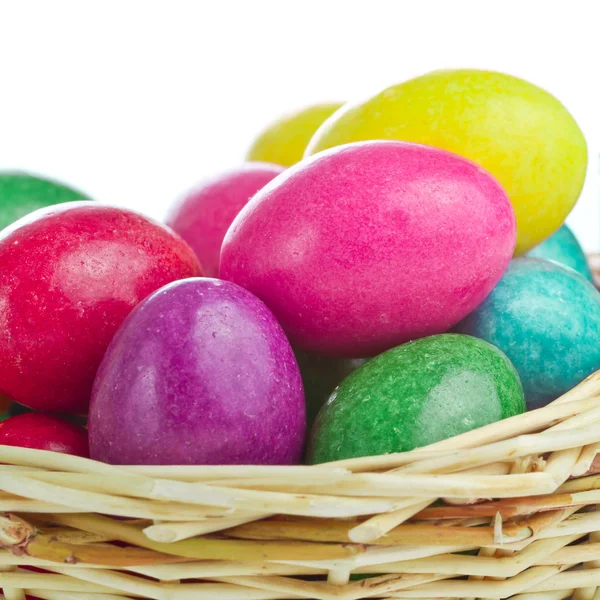 Colorful easter eggs in basket — Stock Photo, Image