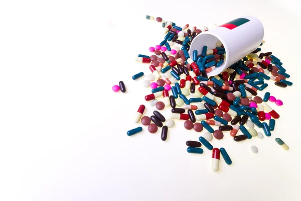 stock image Pills spilling out of container