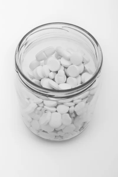 Pillole in contenitore di vetro — Foto Stock