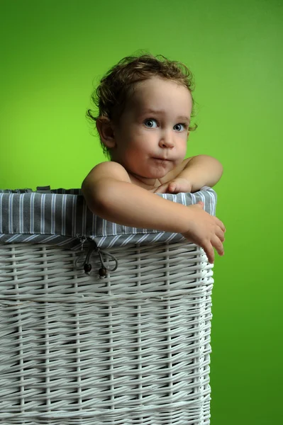 Baby sitting in a basket — Stock Photo, Image