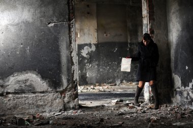 Retro beauty in an indoor location, with newspaper