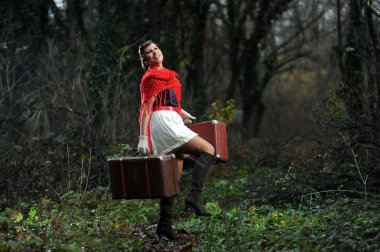 Retro woman with suitcases