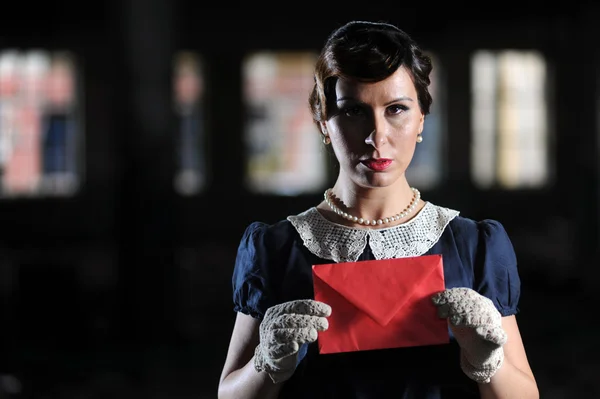 stock image Retro beauty in an indoor location, with red envelope