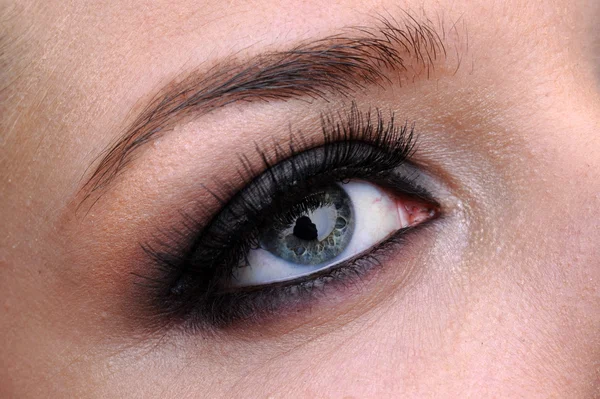 Vrouw blauw oog — Stockfoto