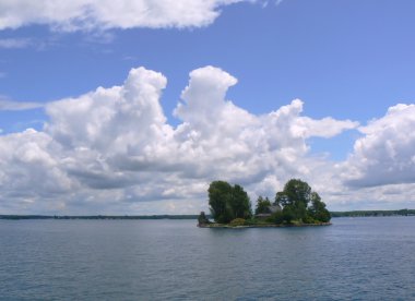 Island with a house on Ontario lake, Canada clipart