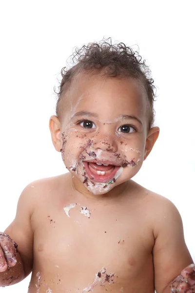 Doce menino comendo bolo de aniversário — Fotografia de Stock