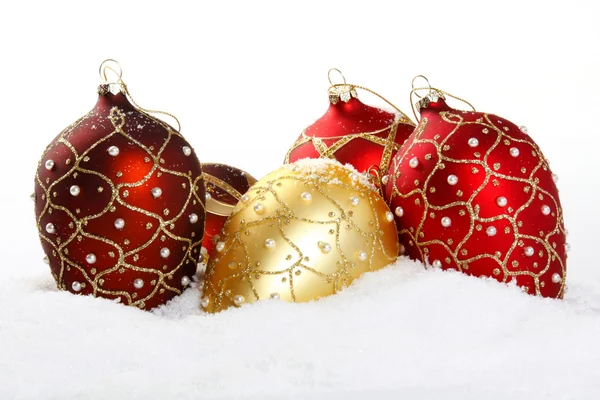 Christmas bauble on white snow background — Stock Photo, Image
