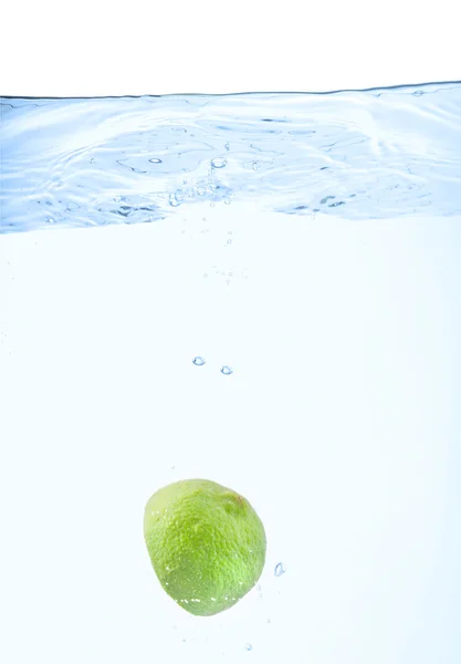 Lime just after falling under the wate — Stockfoto