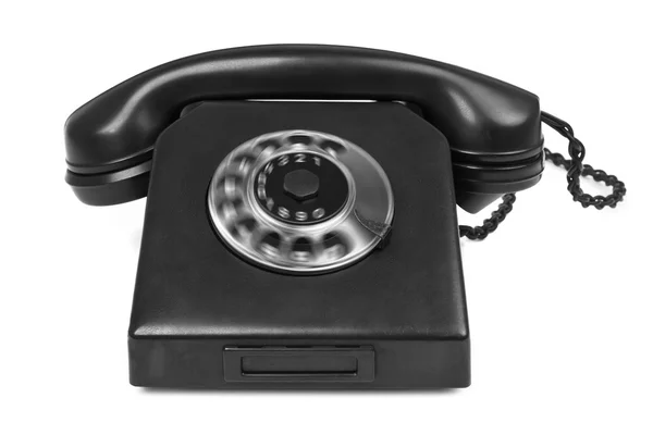 Altes Bakelit-Telefon mit Drehscheibe auf weiß lizenzfreie Stockbilder