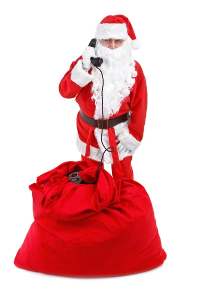 Santa claus receives a phone call — Stock Photo, Image