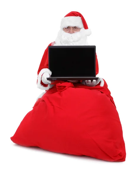 Santa claus shows laptop — Stock Photo, Image