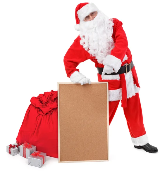 Weihnachtsmann zeigt leere Pinnwand — Stockfoto