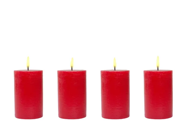 Vier rote Kerzen, weißer Hintergrund — Stockfoto