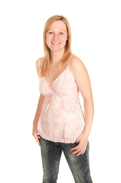 Young woman in pink shirt and jeans — Stock Photo, Image