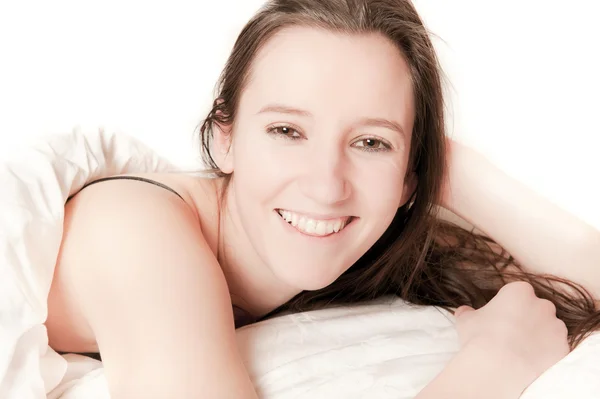 Cute Laughing Woman Lying White Bed Desaturated — Stock Photo, Image