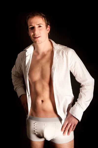 stock image Young man in white open shirt and shorts