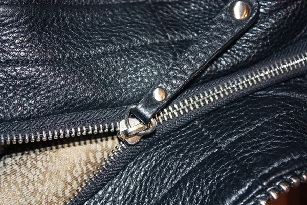 Background of black leather and zips — Stock Photo, Image