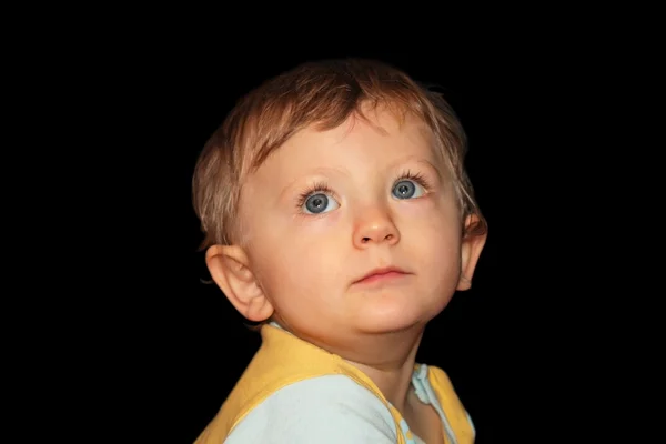 Portrait of a child on a black background — Stock Photo, Image
