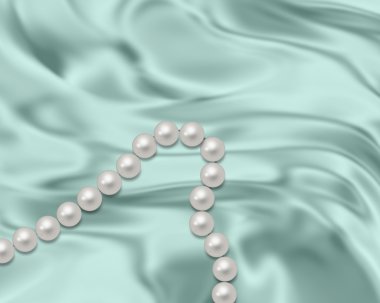 A pearl necklace on a blue silk clipart