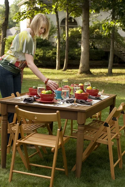 Woman Setting Table for Outdoor Dinner Party — Stock Photo, Image