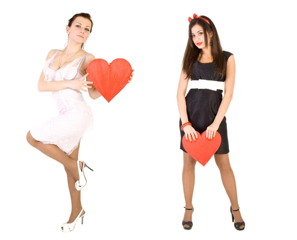 Two girls with red hearts — Stock Photo, Image