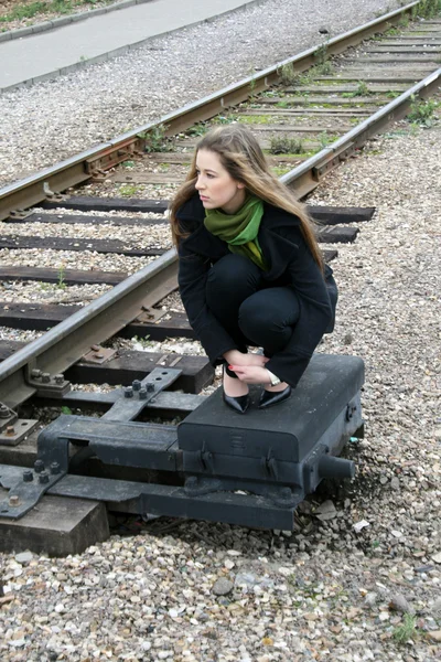 stock image Girl sitting near railroad